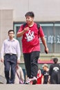 Overweight young man on pedestrian bridge, Beijing, China